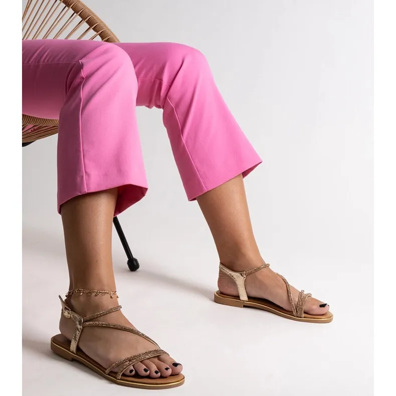 Gold sandals decorated with Caramella zircons golden