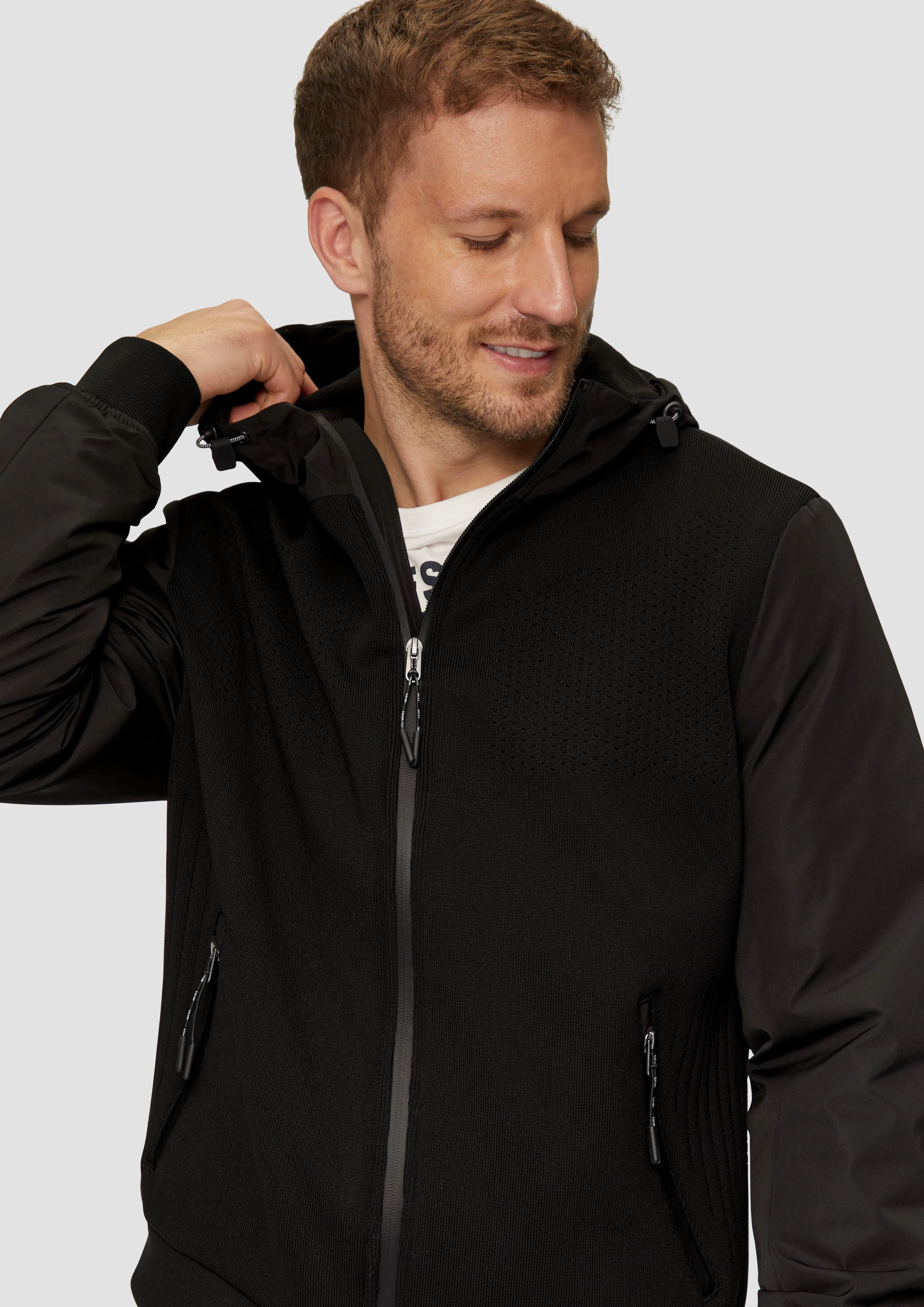 Hooded jacket with an innovative mix of materials