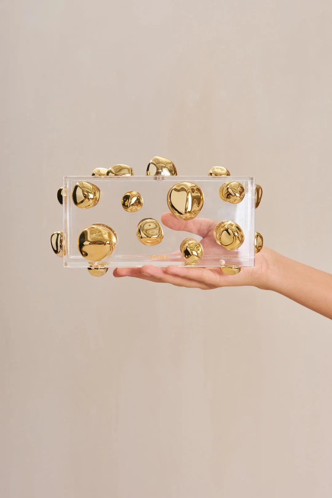 ORBS CLUTCH - SHINY BRASS