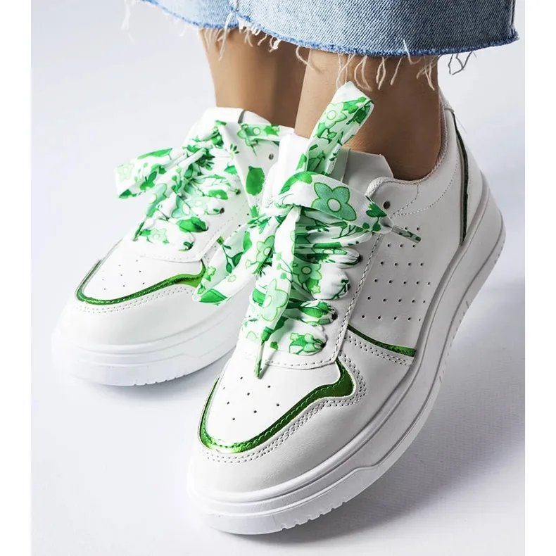 White sneakers tied with Pryor ribbon