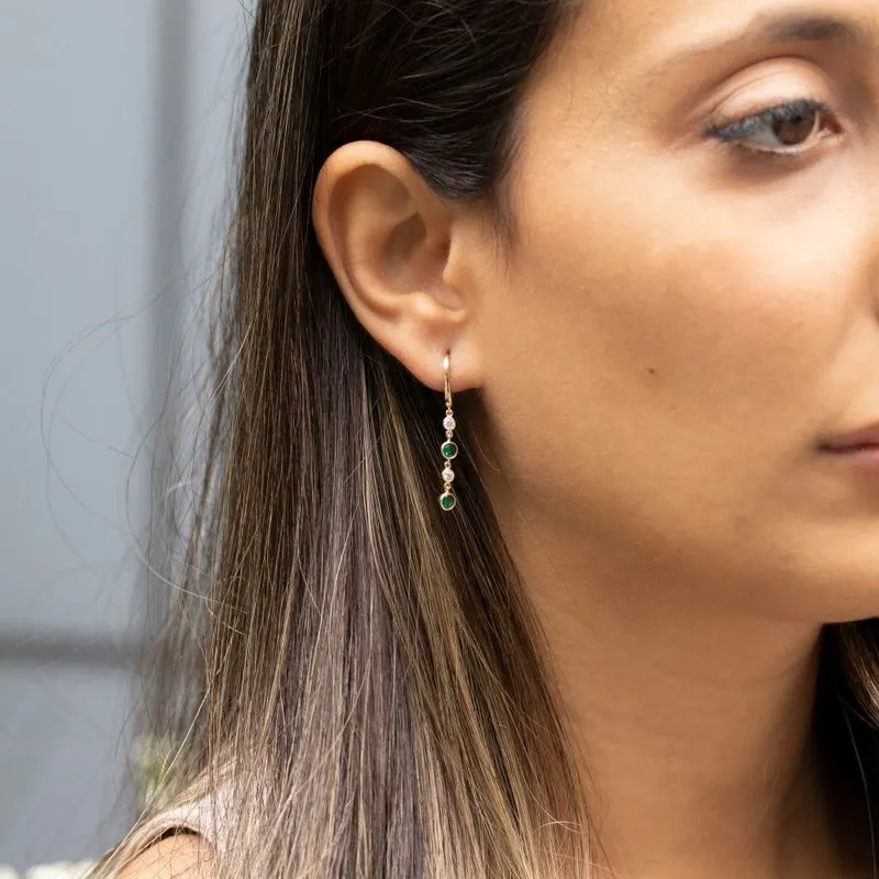 Yellow gold dangling earring with 2 green and white zircons