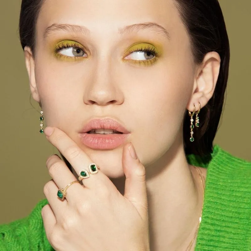 Yellow gold dangling earring with 2 green and white zircons